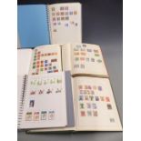 Two Freelance and a Senator stamp album of all-world and used stamps, and two modern albums of UK