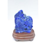 Chinese lapis lazuli carving of a mountainous scene on stand, 8.8 x 10.5cm