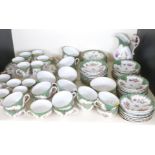 A quantity of Dresden porcelain tea and coffee ware with wrythen moulded, floral decoration and