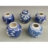 Five Chinese blue and white prunus flower porcelain ginger jars, one with over glazed maker's mark