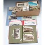 Three albums of postcards and a box of loose examples to include London, railway interest, Wales,