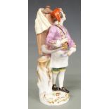 Meissen figure of a water carrier, blue crossed swords mark and impressed numbers 21 and 150 to