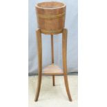 Coopered oak jardiniere stand, H91cm