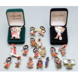 Nineteen Golly badges including Christmas World Cup '98 and sporting examples