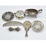 Chinese white metal comb, Chinese mirror, a phurba, sauce boat, two dishes, and a tea pot