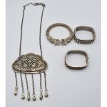 Three Chinese bangles and a Chinese white metal item