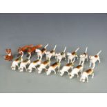 A large collection of Beswick hounds and foxes, H7cm