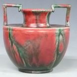 Minton Astra Ware Secessionist style twin handled pedestal vase decorated with a green and red