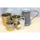 Arts and Crafts style copper jug with riveted handle, graduated set of three brass grain measures,