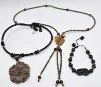 A nephrite jade and tiger's eye necklace, an agate pendant, and a Chinese hardstone bracelet