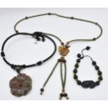 A nephrite jade and tiger's eye necklace, an agate pendant, and a Chinese hardstone bracelet