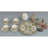 A collection of Chinese and Japanese ceramics including a famille rose dish (25cm in diameter), cups