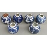 Six Chinese blue and white prunus flower ginger jars, one with maker's mark to base, largest 11cm