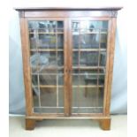 Georgian mahogany glazed display cabinet raised on bracket feet, W131 x D37 x H173cm