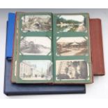 Four postcard albums including Edwardian coastal scenes, Stockport, small album of reproduction nude