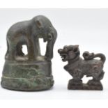 A 19thC Chinese finely cast miniature bronze Dog of Fo figure 2.1cm and a bronze elephant on