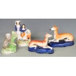 Four Staffordshire figures including two greyhound pen stands, monkey etc, tallest 16cm