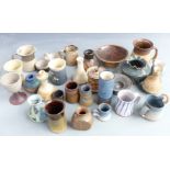 A large collection of studio pottery including Troika vase, Glynhir, some signed pieces, tallest