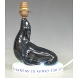 An original Carltonware Guinness seal advertising lamp Guinness is Good for You, H24cm