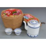 Chinese blue and white tea set in fitted wicker carry case, case 21x25x25cm.  COLLECTING