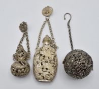Two Chinese bottles to attach to a chatelaine and a Chinese pierced ball