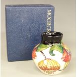 Moorcroft squat vase with tube lined flower decoration, 1998 to base, H9cm, with box
