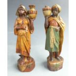 A pair of terracotta blackamoor water carrier figures possibly Goldscheider, with impressed