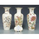 Three large Zsolnay Pecs vases and an advertising plaque, tallest 34cm
