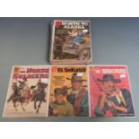 Twenty-four Dell and Gold Key Western comics including John Wayne, Maverick, Have Gun Will Travel,