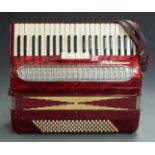 Pigliacampo Numano 120 bass piano accordion, in red pearloid finish with two treble couplers,