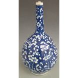 A 19thC Chinese blue and white bottle vase decorated with prunus blossom, 40cm tall.