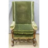 19thC mahogany upholstered wing back armchair with shaped apron, moulded detail and gnurled feet,