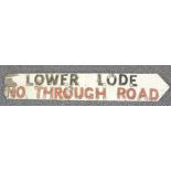 Traditional English wooden crossroads sign with screwed on letters 'Lower Lode - no through road' of