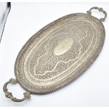 Indian or Burmese white metal two handled tray with embossed decoration, given to the vendor's