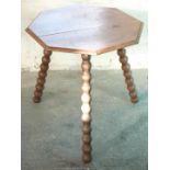 An oak cricket table with bobbin turned legs, H61 x diameter 60cm