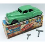 Tri-ang Wizard Stop-On clockwork model car with green body, black wheels, two keys, silver bumpers