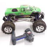 Savage HPI Racing nitro powered radio controlled monster truck with Aggressor SRX radio transmitter.