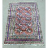 Turkoman rug with ten guls and multiple geometric borders, 183 x 122cm