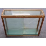 Dinky Toys shop display or advertising display cabinet with glass shelves and sliding doors,