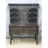 A 19th/ 20thC carved oak dresser of unusually small size, W106 x D44 x H147cm