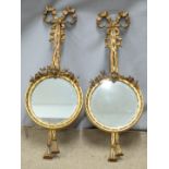 A pair of gilt framed mirrors with swag decoration, W24 x H65cm