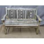 A teak garden bench, W130cm