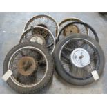 Six motorbike wheels including early AMC/Ariel/Francis Barnett