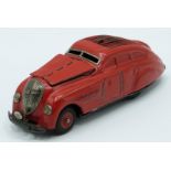 Schuco Kommando 2000 clockwork tinplate model car with red body and hubs.