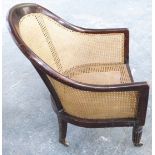 A 19thC bergere armchair with mahogany frame