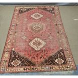 A large Persian rug, 380 x 270cm
