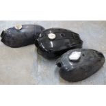 Three motorbike petrol tanks including BSA Sprite