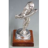 Rolls Royce Spirit of Ecstasy mascot with spring base, on mahogany plinth, height 14.5cm