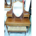 Edwardian inlaid mahogany dressing table with bevelled glass shield shaped swing mirror, raised on