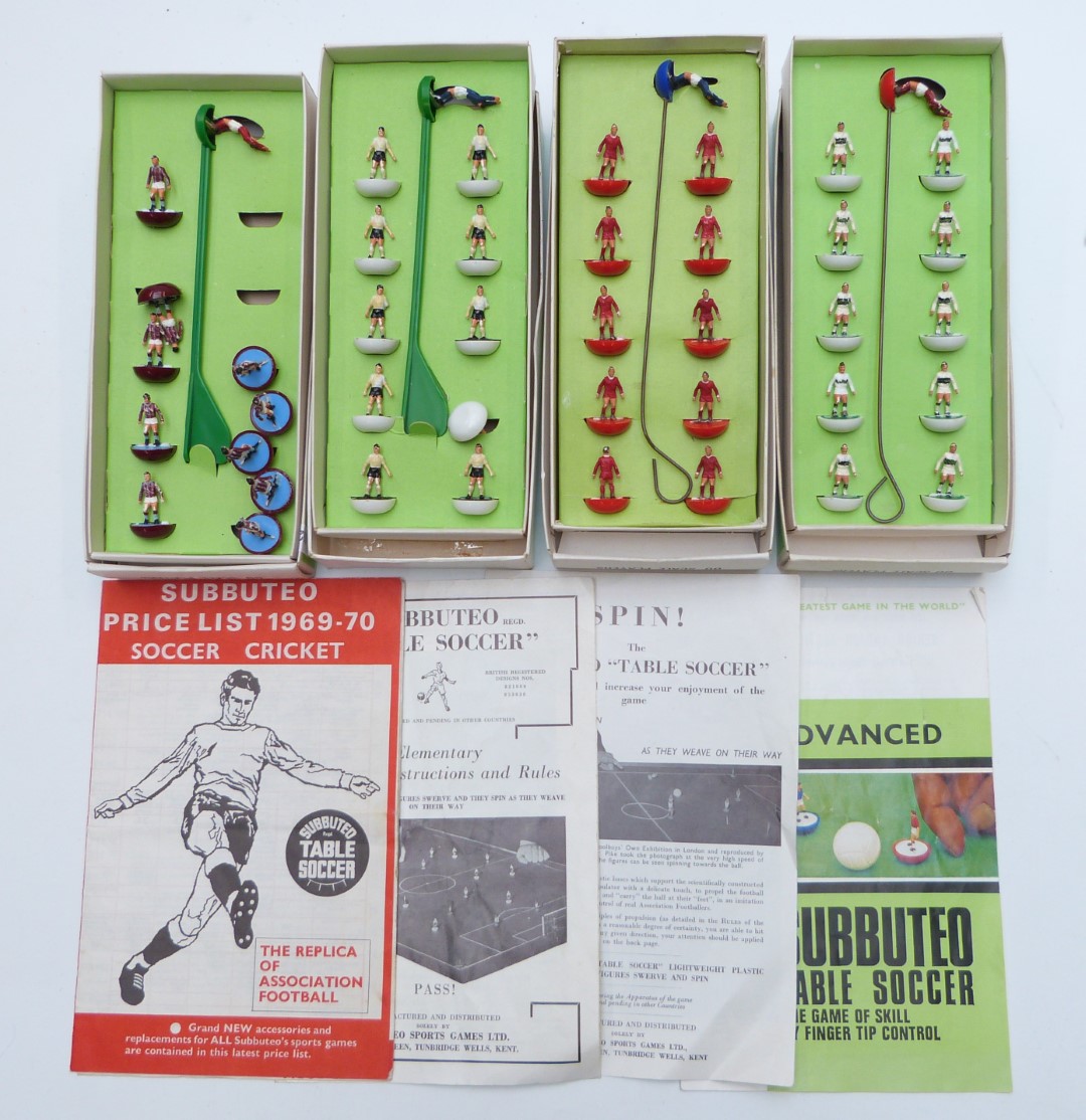 Four Subbuteo table soccer teams Fulham, Plymouth Argyle, Liverpool and Crystal Palace, all in